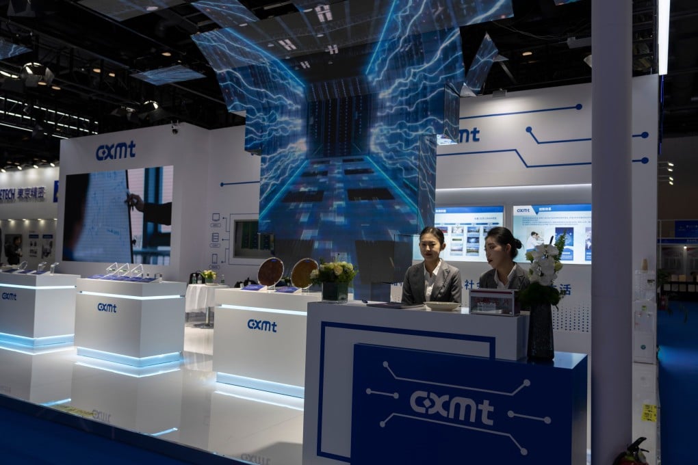 Workers at a booth for CXMT wait for visitors at the China International Semiconductor Expo in Beijing. Photo: AP