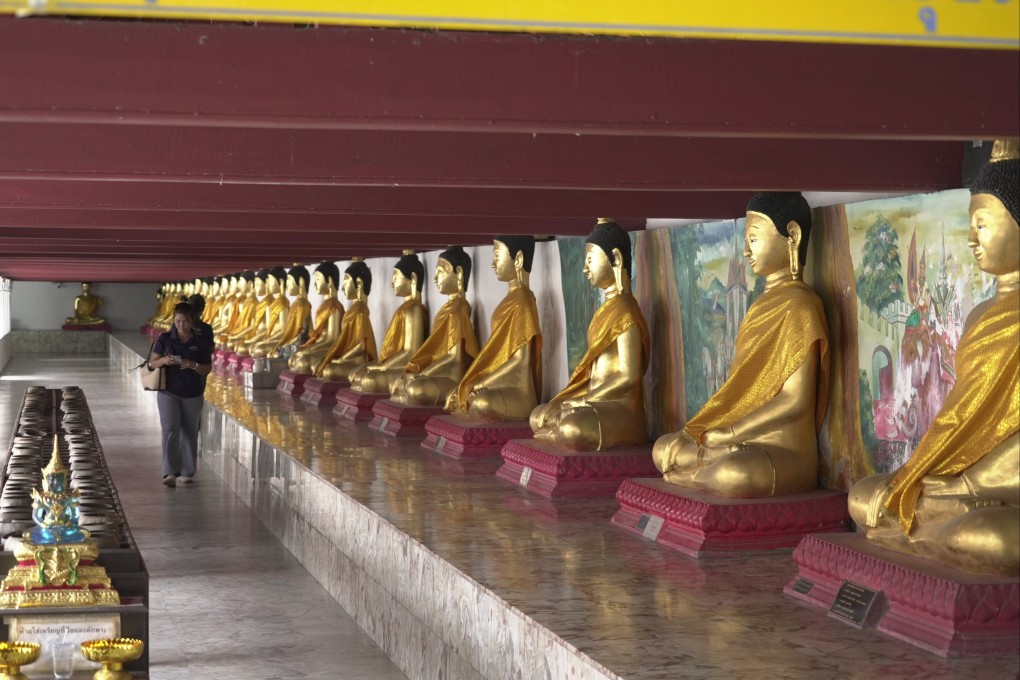 Visitors walks inside Wat Phra Mahathat Woramahawihan, a 13th-century Buddhist temple in Nakhon Si Thammarat city, Thailand, on July 3. Photo: AP