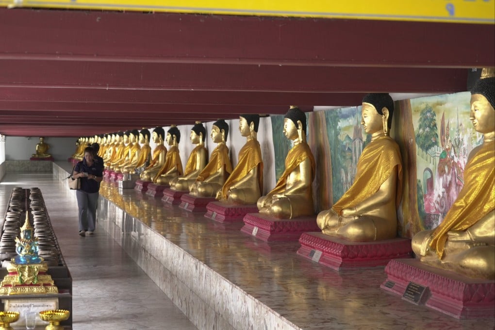 Visitors walks inside Wat Phra Mahathat Woramahawihan, a 13th-century Buddhist temple in Nakhon Si Thammarat city, Thailand, on July 3. Photo: AP