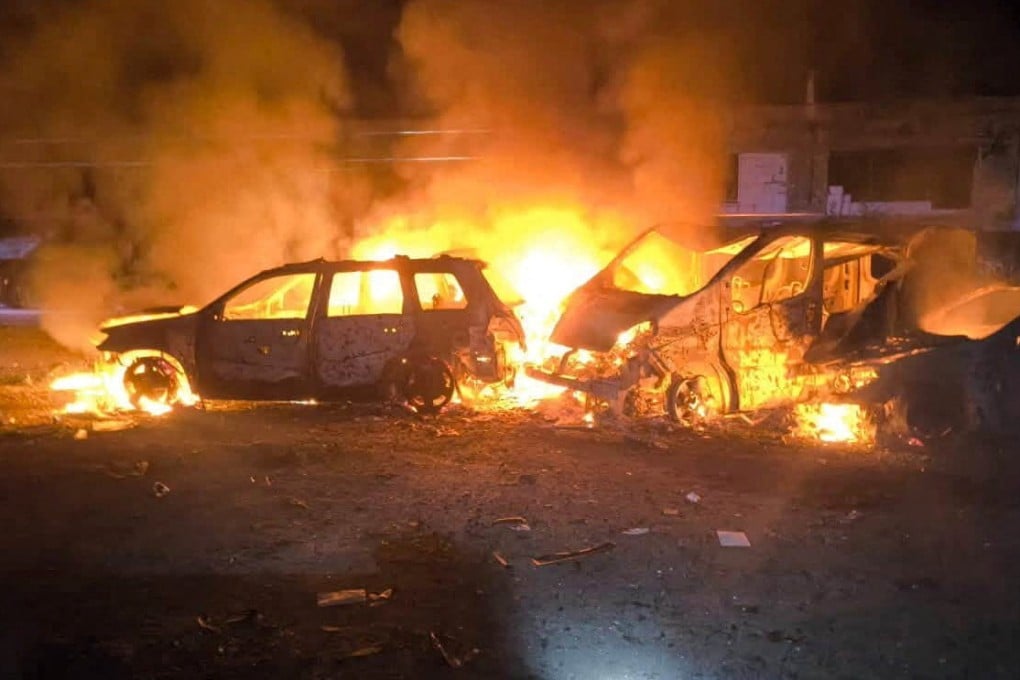 Smoke and fire rise from burning vehicles at the site of a Russian strike in a location given as Kyiv, Ukraine on Sunday. Photo: State Emergency Service of Ukraine in Kyiv Region / Handout via Reuters