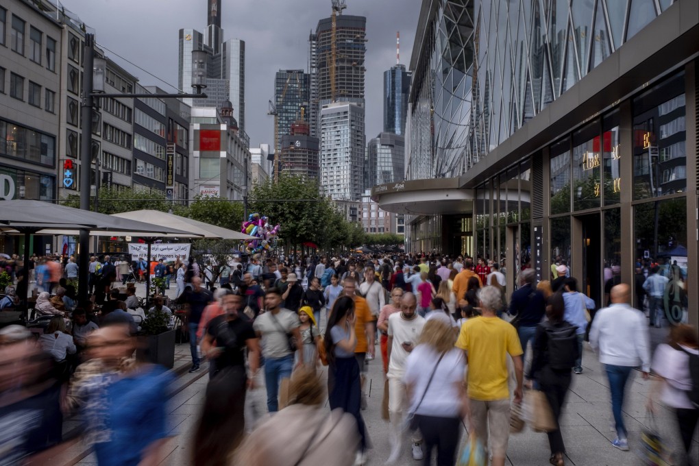 People throng Frankfurt’s main shopping on a Saturday. Photo: AP