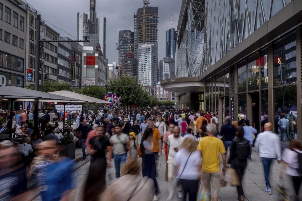 People throng Frankfurt’s main shopping on a Saturday. Photo: AP