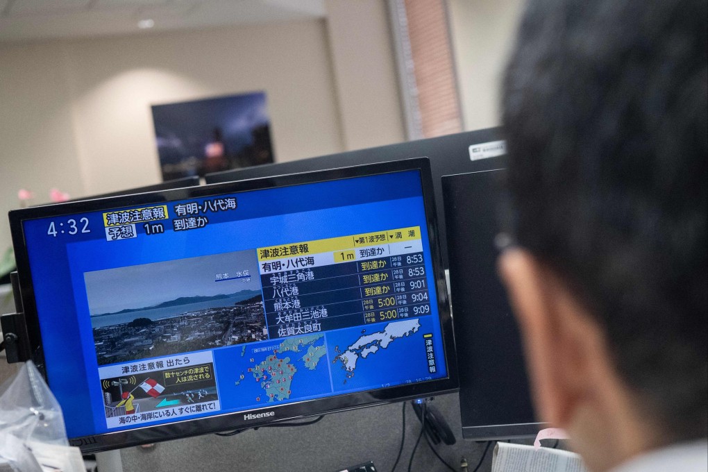 News showing a large quake and possible tsunami wave in southern Japan. Photo: AFP