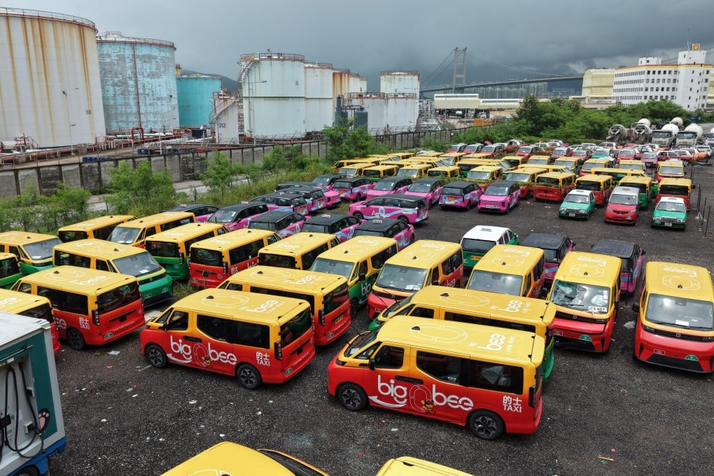 Premium taxis in an outdoor car park in Tsing Yi. More than 2,000 fleet taxis and about 2,400 drivers are currently in service. Photo: Sam Tsang
