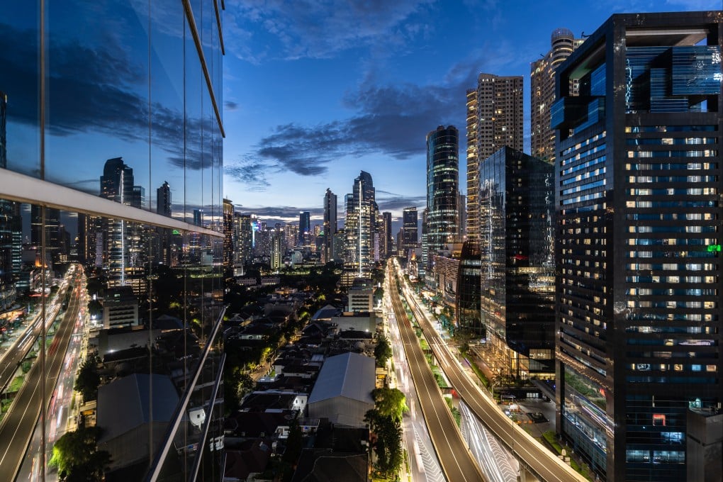 The sun sets over Kuningan business district in Jakarta. Indonesia wants to build a financial centre to rival Singapore, Hong Kong or Dubai. Photo: Shutterstock