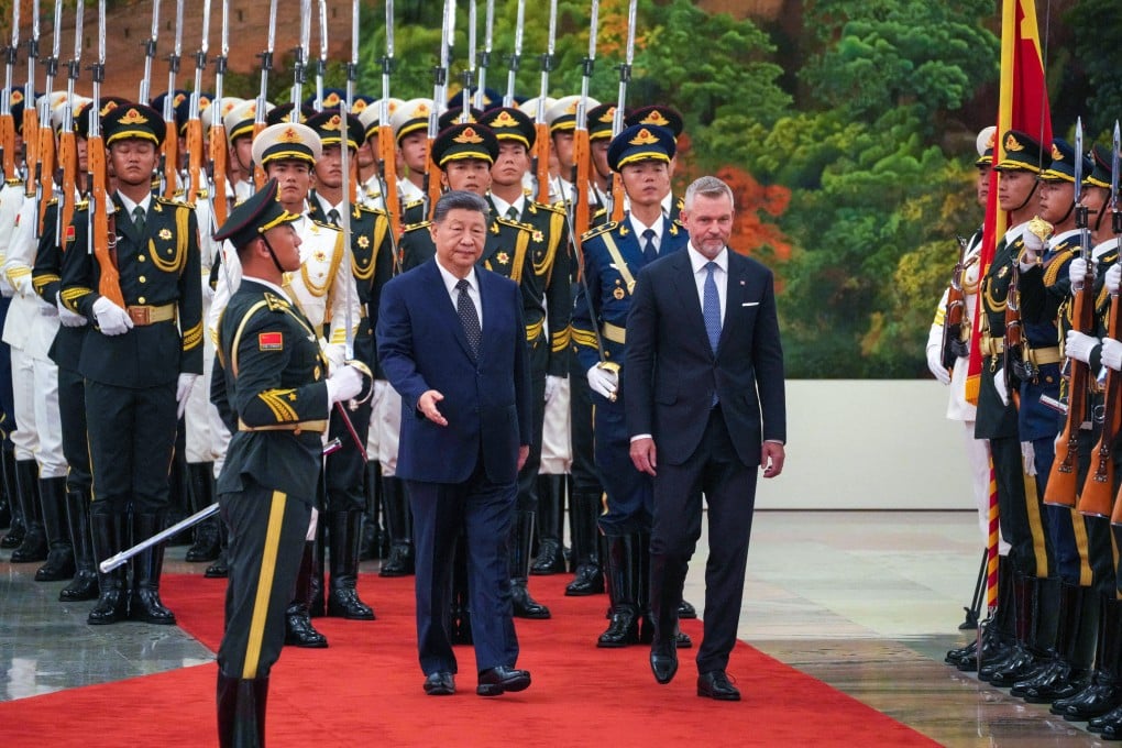 Chinese President Xi Jinping and Slovak President Peter Pellegrini inspect a guard of honor at the Great Hall of the People in Beijing on July 28. Photo: Reuters