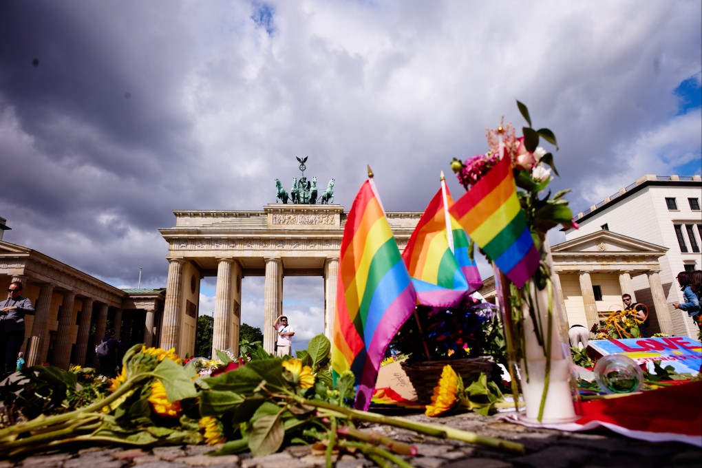 Flowers and rainbow flags in front of the Brandenburg Gate commemorating the victims of a car attack on Berlin’s Pride event. On Monday, the UK said armed officers would be deployed at this weekend’s Brighton and Hove Pride. Photo: AP