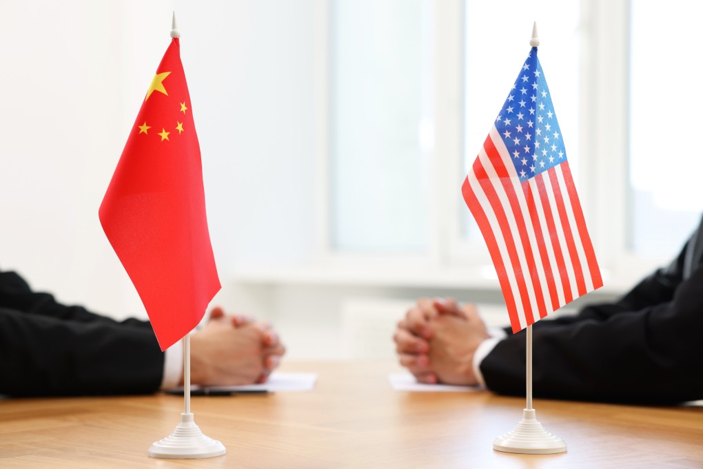 Diplomats negotiating during meeting at table indoors, focus on flags of USA and China ID 2571367755 Photo: Shutterstock
