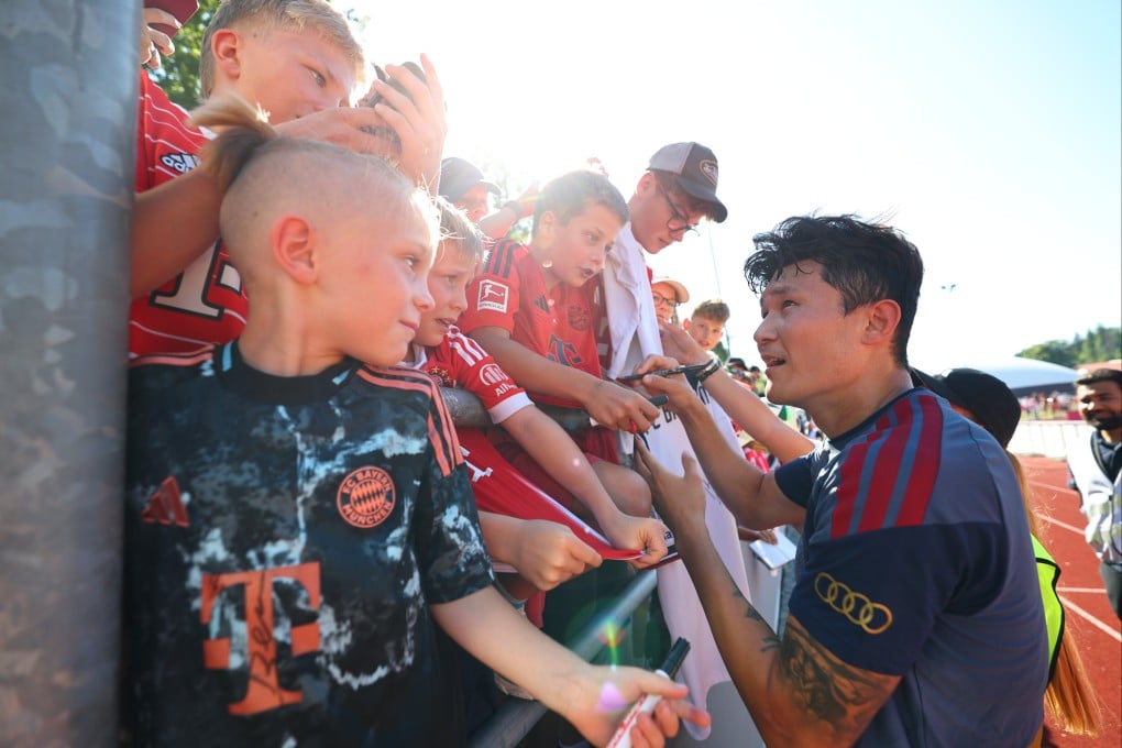 Kim Min-jae of Bayern Munich signs autographs during the team’s ongoing training camp in Germany. Photo:  EPA