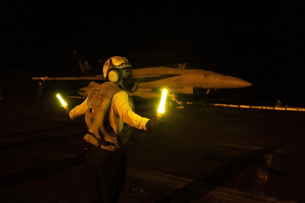 Flight operations on the aircraft carrier USS George H.W. Bush on July 21. US and allied forces launched joint counter-strikes in the region on Tuesday. Photo: US Central Command via AFP