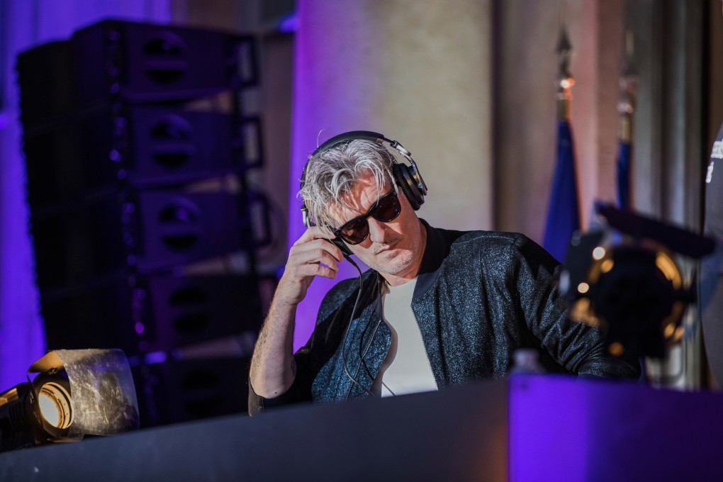 Vincent Belorgey, known as Kavinsky, performs in the courtyard of the Elysee Palace in Paris in 2018. PhotoL via AP