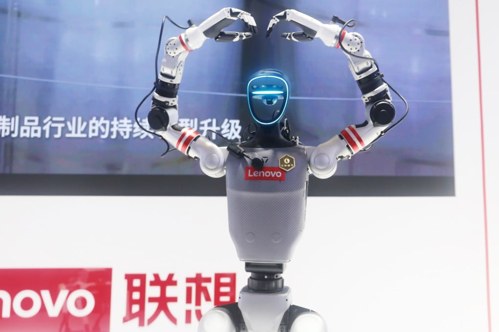 A Lenovo robot forms a heart shape with its hands during the 2025 World AI Conference in Shanghai. Photo: VCG