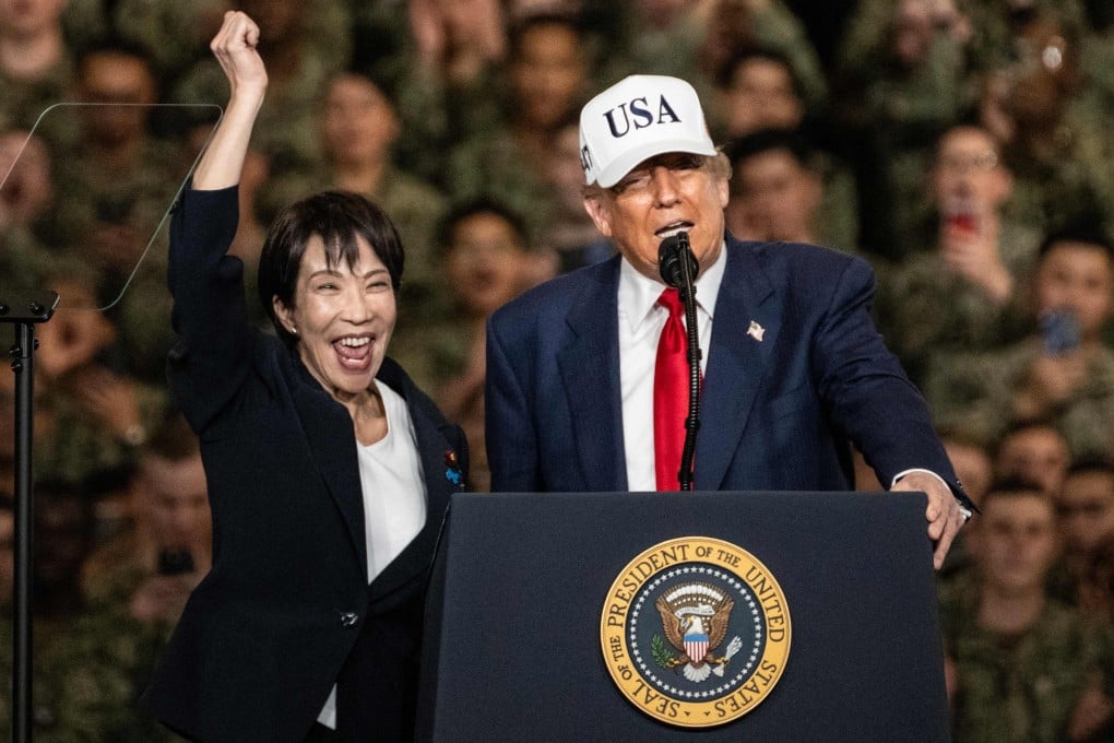 Japan’s Prime Minister Sanae Takaichi (left) gestures as US President Donald Trump delivers a speech in front of US Navy personnel on board the US Navy’s USS George Washington aircraft carrier at the US naval base in Yokosuka, Japan, on October 28, 2025. Photo: AFP
