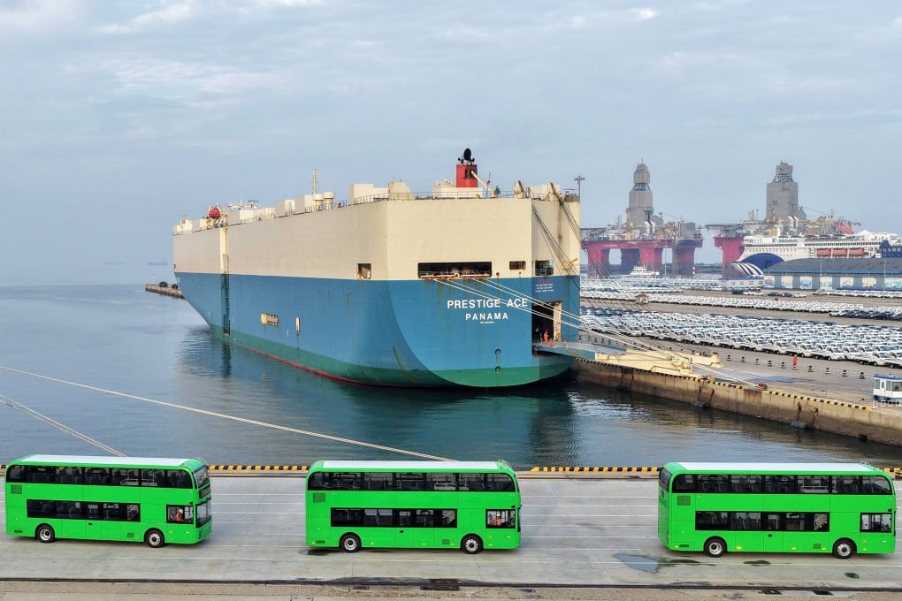 Yutong electric double-decker buses for export to the UK are driven onto a car carrier at Yantai Port in Shandong province on July 27. Photo: AFP