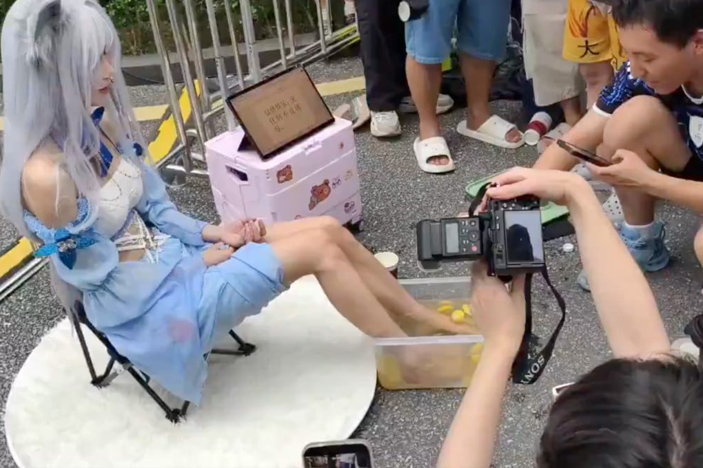 At an anime convention in Guangzhou, a cosplayer drew crowds and criticism by selling
