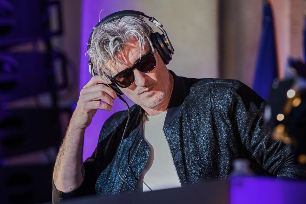 Vincent Belorgey, known as Kavinsky, performs in the courtyard of the Elysee Palace in Paris in 2018. PhotoL via AP