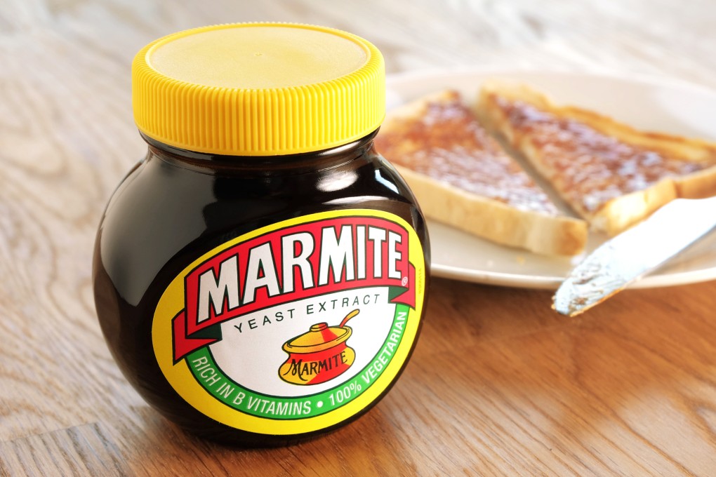 A jar of Marmite alongside one of the preferred vehicles for enjoying the divisive yeast spread: a slice of toast with butter. Photo: Shutterstock