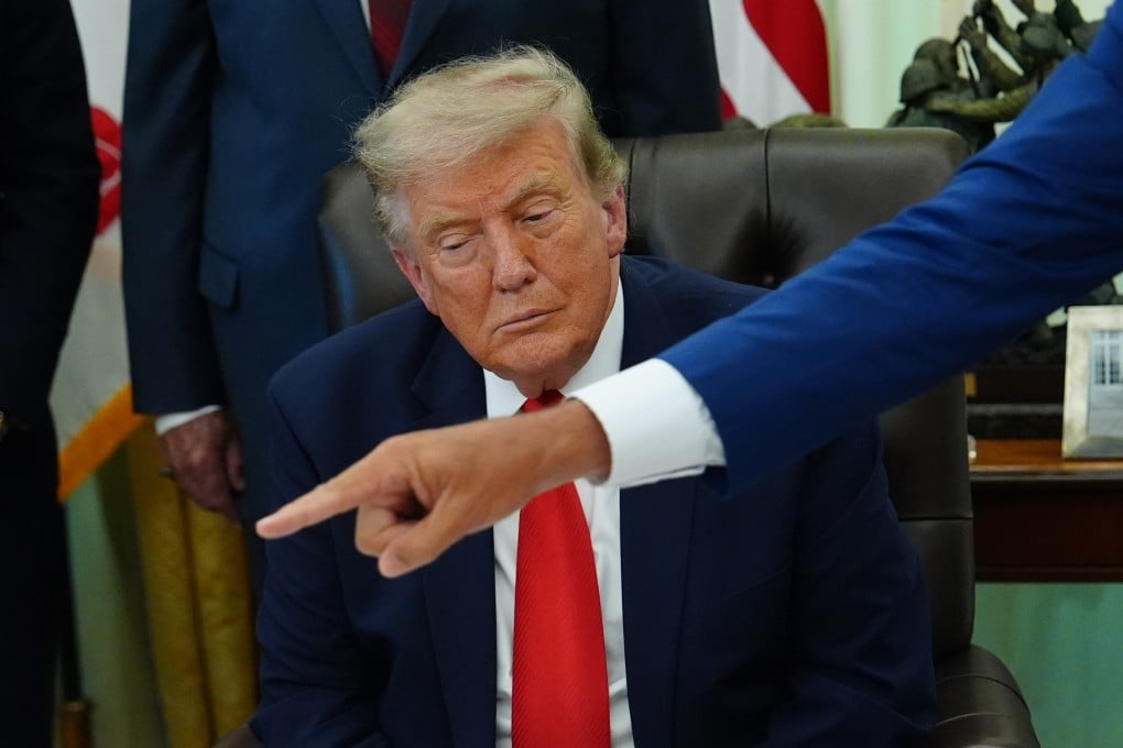 US President Donald Trump listens in the Oval Office of the White House on July 29. Photo: AP