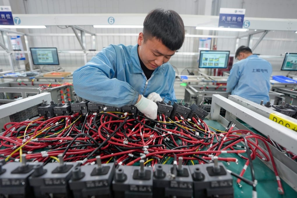 Staff members assemble inverters at an industrial park in Tongxin county in Wuzhong, northwest China’s Ningxia Hui autonomous region, on February 20, 2025. Photo: Xinhua