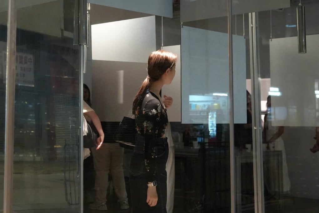 A visitor navigates Thai artist Wim Pimkanchanapong’s “Infinite Maze 189” at Projct in Sai Ying Pun, Hong Kong.