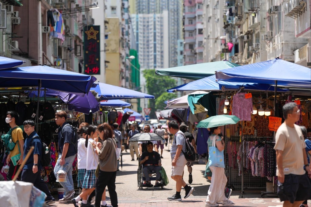 People out and about on a hot June day in Sham Shui Po. Photo: Sam Tsang