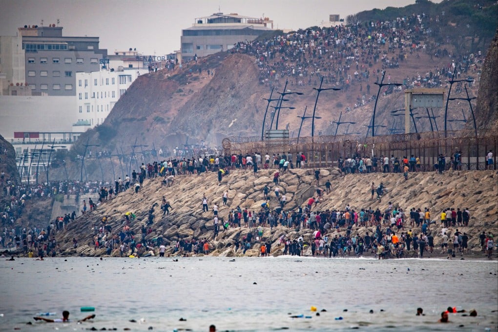 Migrants return to Morocco from the Spanish enclave of Ceuta on Friday. Photo: AP