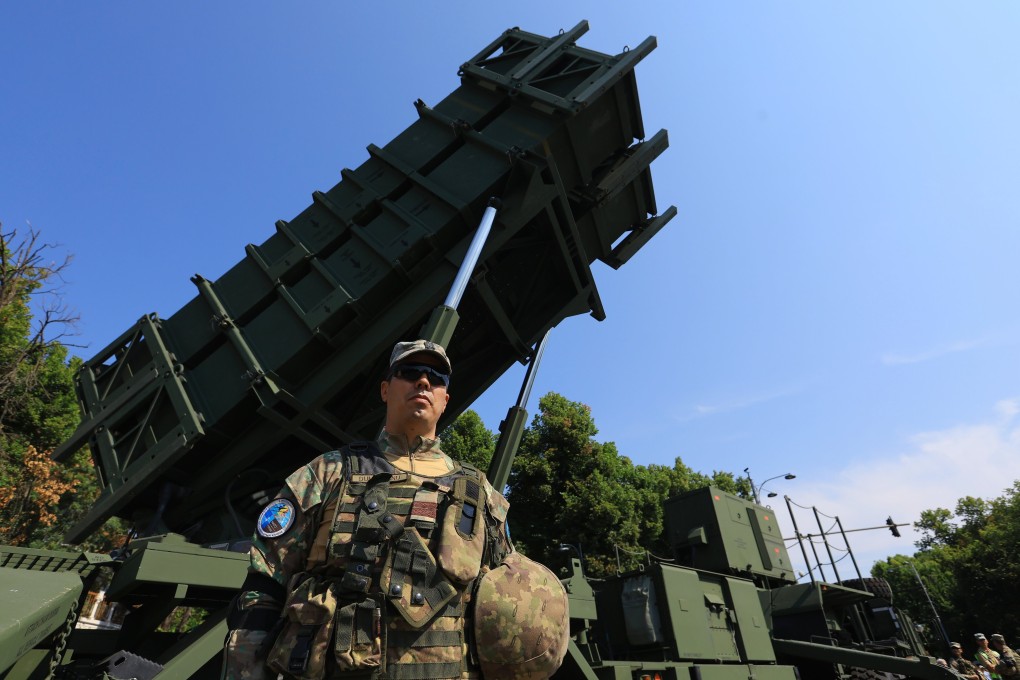 A Romanian soldier stands guard beside a Patriot surface-to-air missile system in Bucharest, Romania, on July 19. Photo: EPA