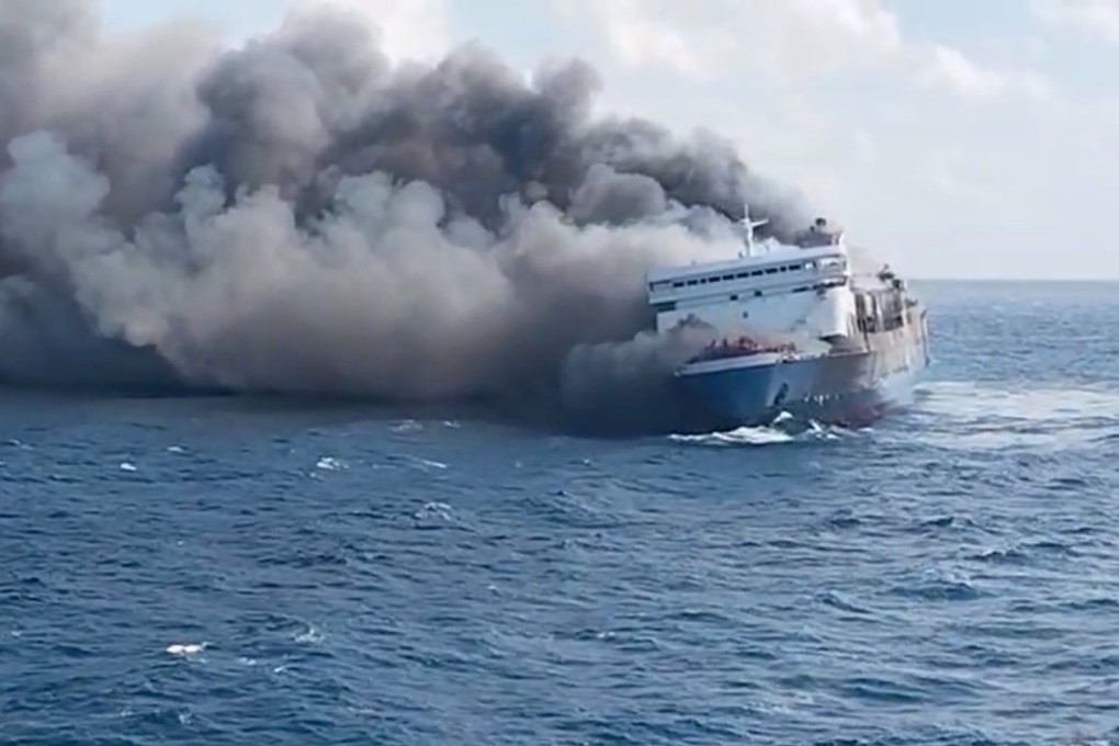 A still image taken from a handout video made available by Indonesia’s National Search and Rescue Agency shows thick smoke billowing from a passenger ferry on Sunday. Photo: via EPA