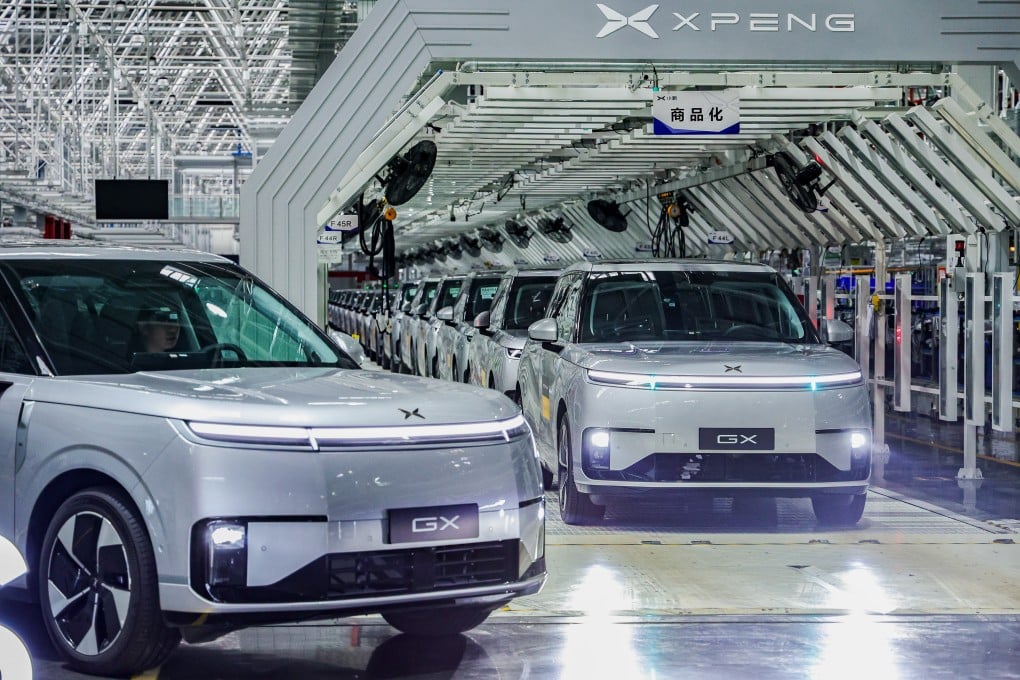 Self-driving taxis made by Xpeng roll off a production line in China. Photo: Xpeng