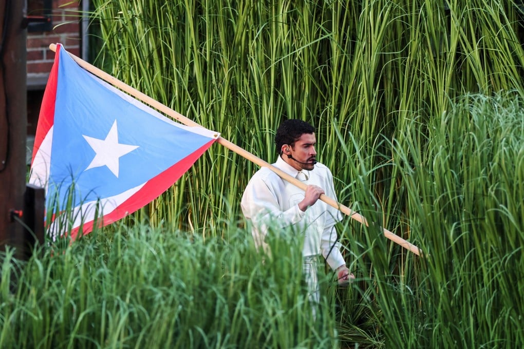 Bad Bunny carries a Puerto Rican flag for the Super Bowl halftime show in Santa Clara, California in February. Photo: The Seattle Times / TNS