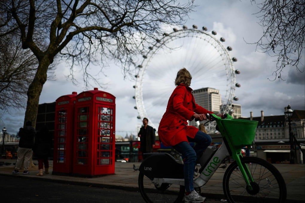 A woman cycles along Embankment backdropped by The London Eye. British man Christopher Phillips, 60, had admitted preventing the lawful and decent burial of his 89-year-old mother Sylvia Phillips after she died in March 2023. Photo: AFP