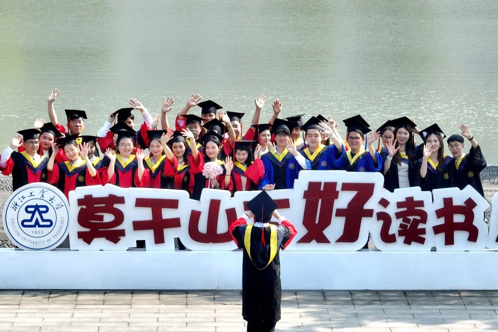 Students pose for graduation photos on the campus of Zhejiang University of Technology, June 2, 2026. Photo: VCG via Getty Images