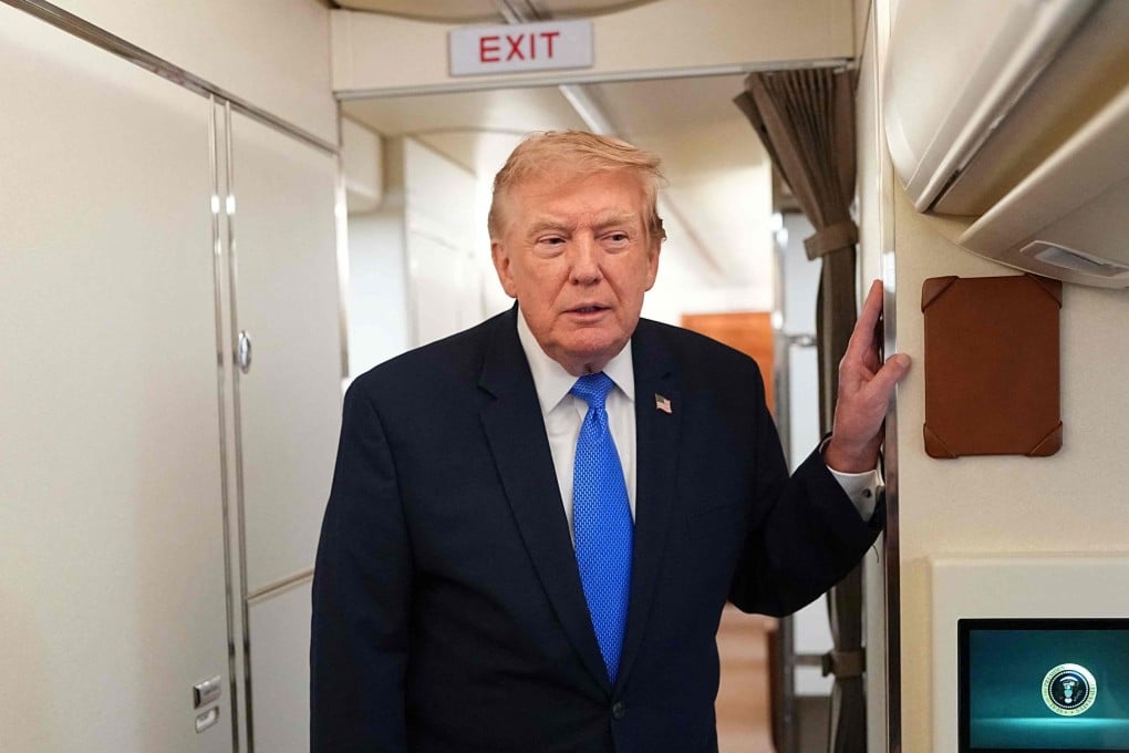 US President Donald Trump speaks to reporters aboard Air Force One on Sunday. Photo: AFP