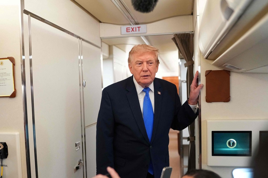 US President Donald Trump speaks to reporters aboard Air Force One on Sunday. Photo: AFP