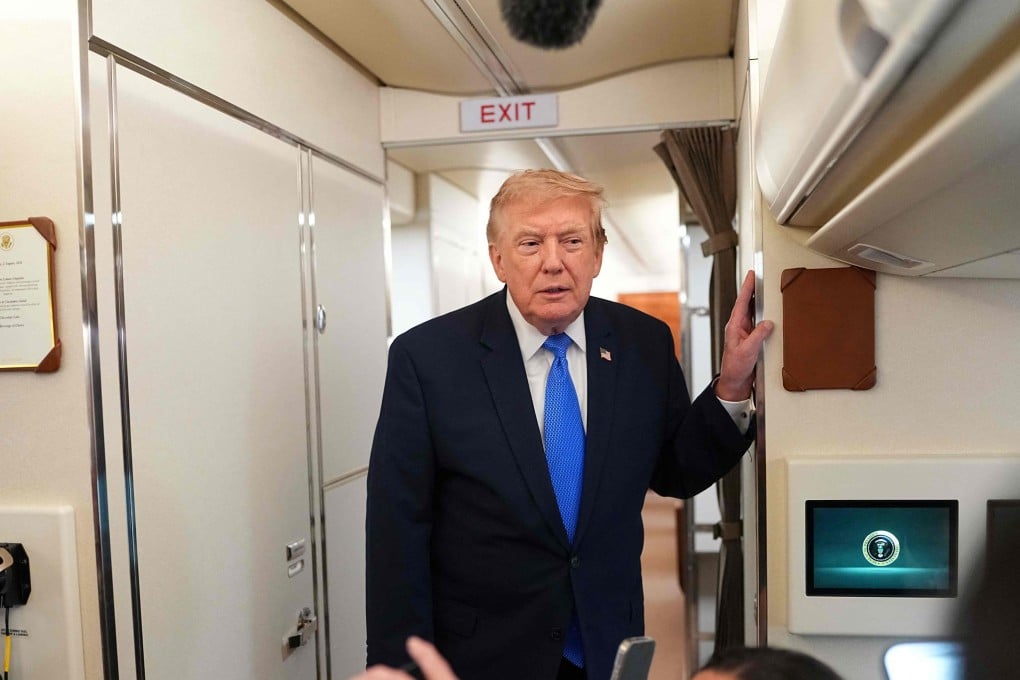 US President Donald Trump speaks to reporters aboard Air Force One on Sunday. Photo: AFP