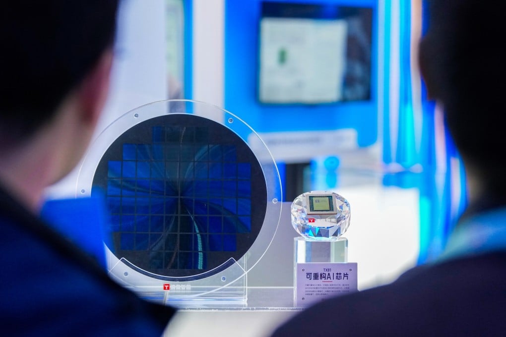 People learn about a reconfigurable AI chip at the permanent exhibition at the Zhongguancun Exhibition Center in Beijing. Photo: Xinhua