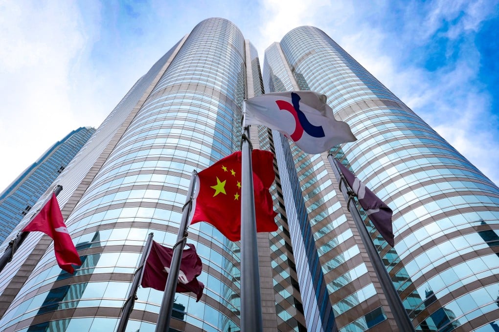 Flags, including the Hong Kong Special Administrative Region and Chinese national flags, at Exchange Square in Central, Hong Kong, where the city’s stock exchange is located. Jelly Tse
