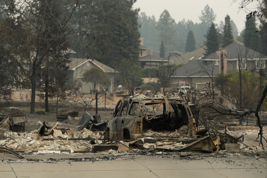 The remains of a car and structures reduced to ash in Spokane, Washington. Photo: AP