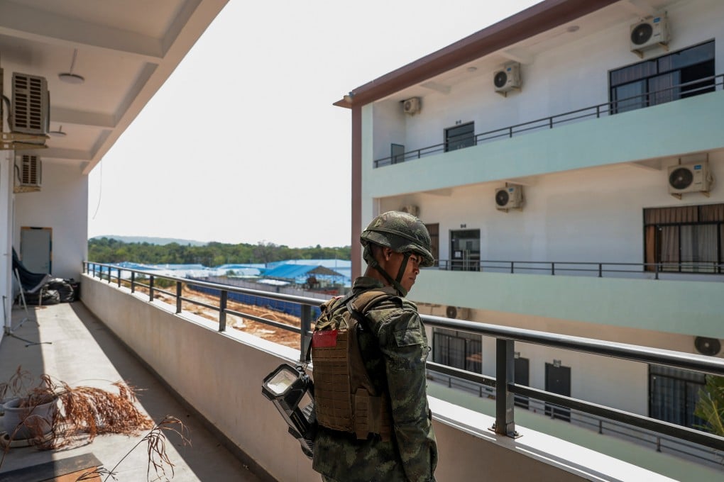 A Thai soldier stands guard in a compound that the Thai military says was used for scam operations, in the town of O’Smach, along Cambodia’s northern border with Thailand, on April 7. Photo: Reuters