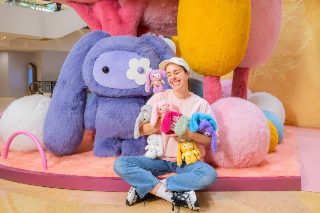 CJ Hendry with a collection of Juju plushies at “Juju World”. Photo: courtesy Pacific Place