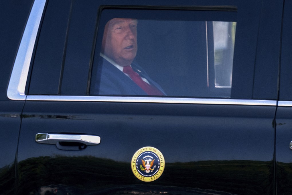 US President Donald Trump riding in his limousine. Photo: AP