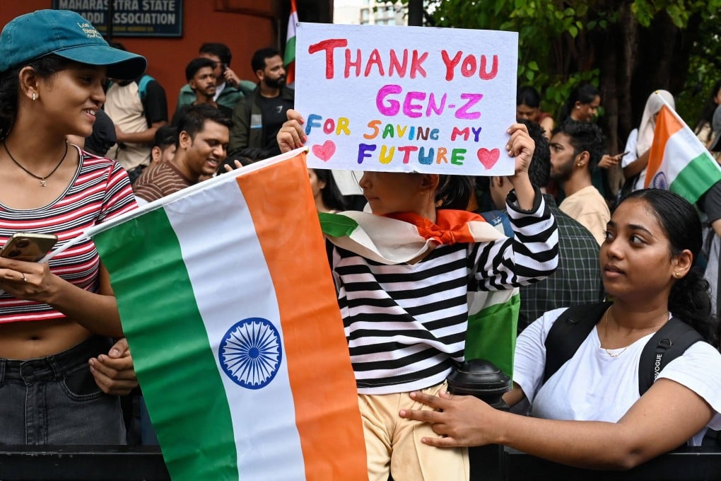 People celebrate the resignation of India’s Education Minister Dharmendra Pradhan in Mumbai on July 26 during a protest over the alleged question paper leaks. Photo: AFP
