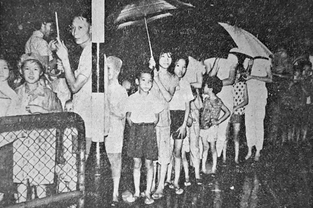 Despite heavy rain, Hongkongers form a long queue outside a clinic in Wan Chai to be inoculated against cholera on August 17, 1961. File photo: SCMP