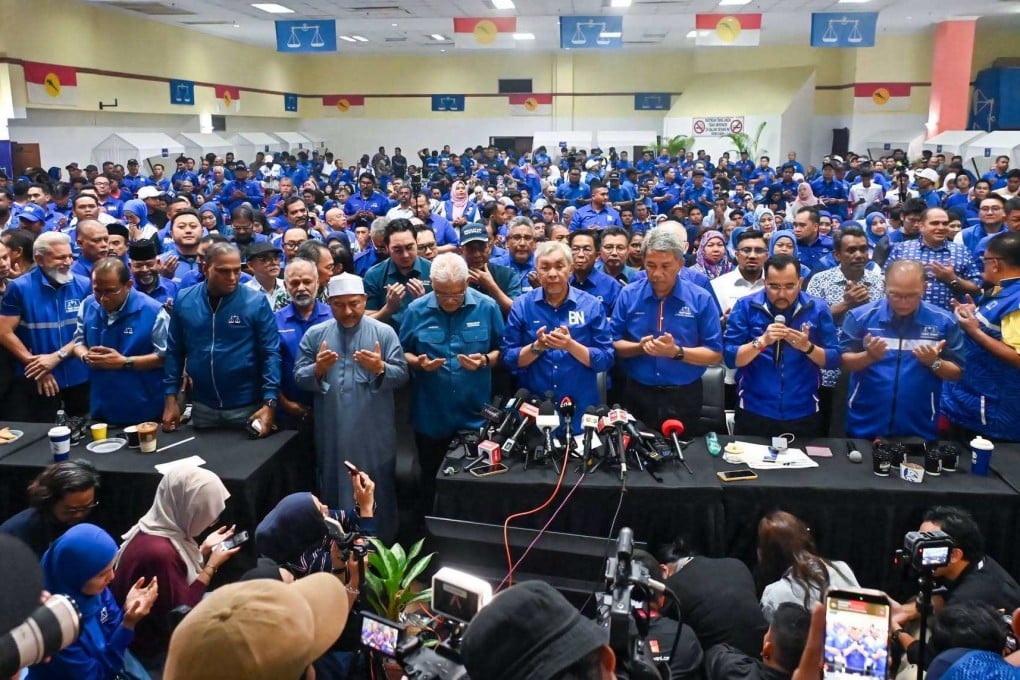Umno members pray after the Negeri Sembilan election results on Saturday. Photo: Facebook/mediaumnomalaysia