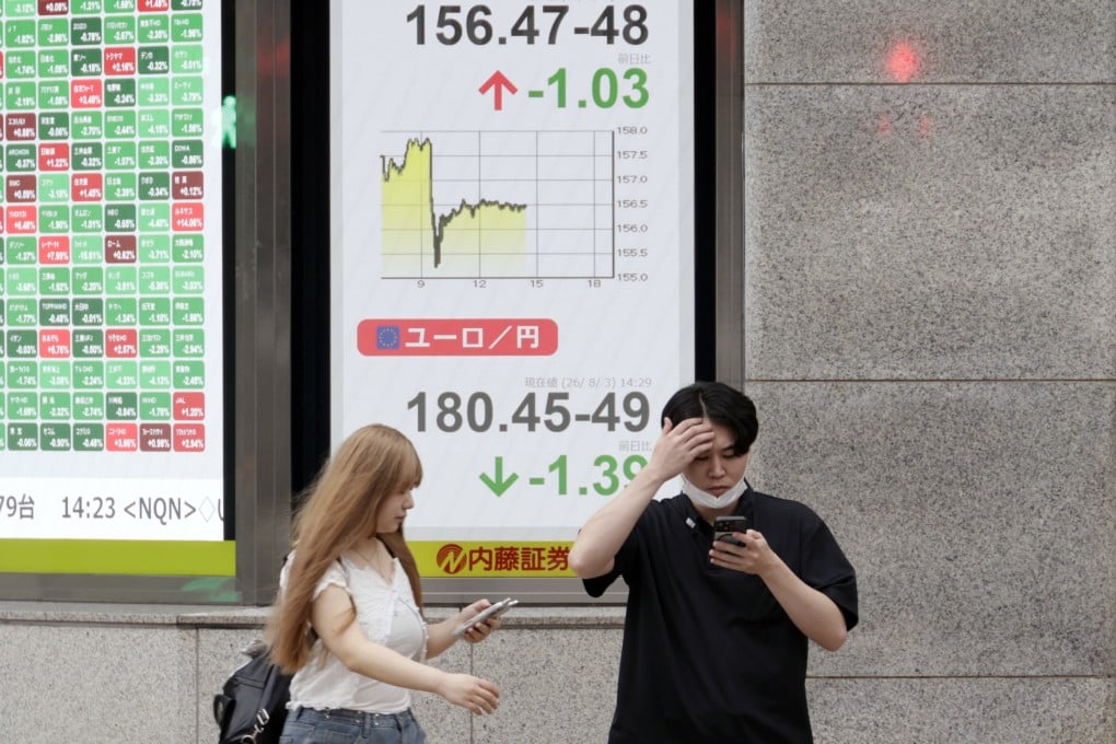 Pedestrians pass a foreign currency indicator board showing the rate of the US dollar against the Japanese yen in Tokyo on August 3. The yen surged against the US dollar, reaching its strongest level in about three months after Japanese and US monetary authorities conducted a coordinated intervention to buy the yen for the first time in 28 years. Photo: EPA