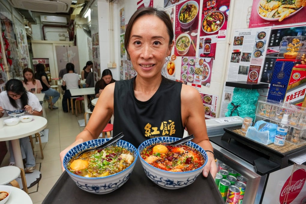 The Red Cuisine owner Joyce Yuen serves dishes at her restaurant in Quarry Bay, Hong Kong. Many restaurants in the city are struggling with falling customer numbers as more locals head to Shenzhen for cheaper meals. Photo: May Tse