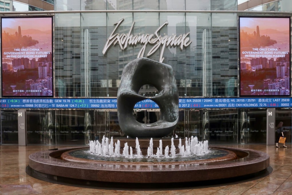 Hong Kong Exchanges and Clearing electronic boards show news of the China government bond futures launch at Exchange Square in Central, Hong Kong, on August 3. Photo: SCMP/Jonathan Wong