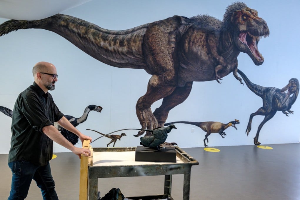 A model of a Microraptor (front) is wheeled out for display at the American Museum of Natural History in New York. The crow-sized Microraptor was one of the smallest-known dinosaurs, weighing about 430 grams. Photo: Reuters
