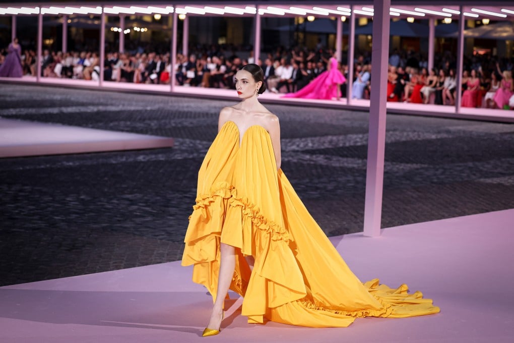 A model walks the runway in a saffron taffeta gown at the Carolina Herrera spring/summer 2026 fashion show at Plaza Mayor in Madrid, Spain, in September 2025. Photo: Getty Images