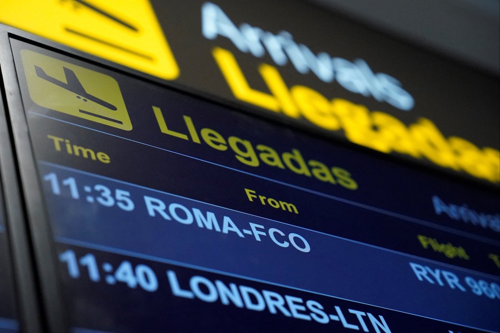 An information panel displays flight details on Saturday at Adolfo Suarez Madrid–Barajas Airport, as Spain’s government said it would establish border controls for flights and ships from Italy. Photo: Reuters